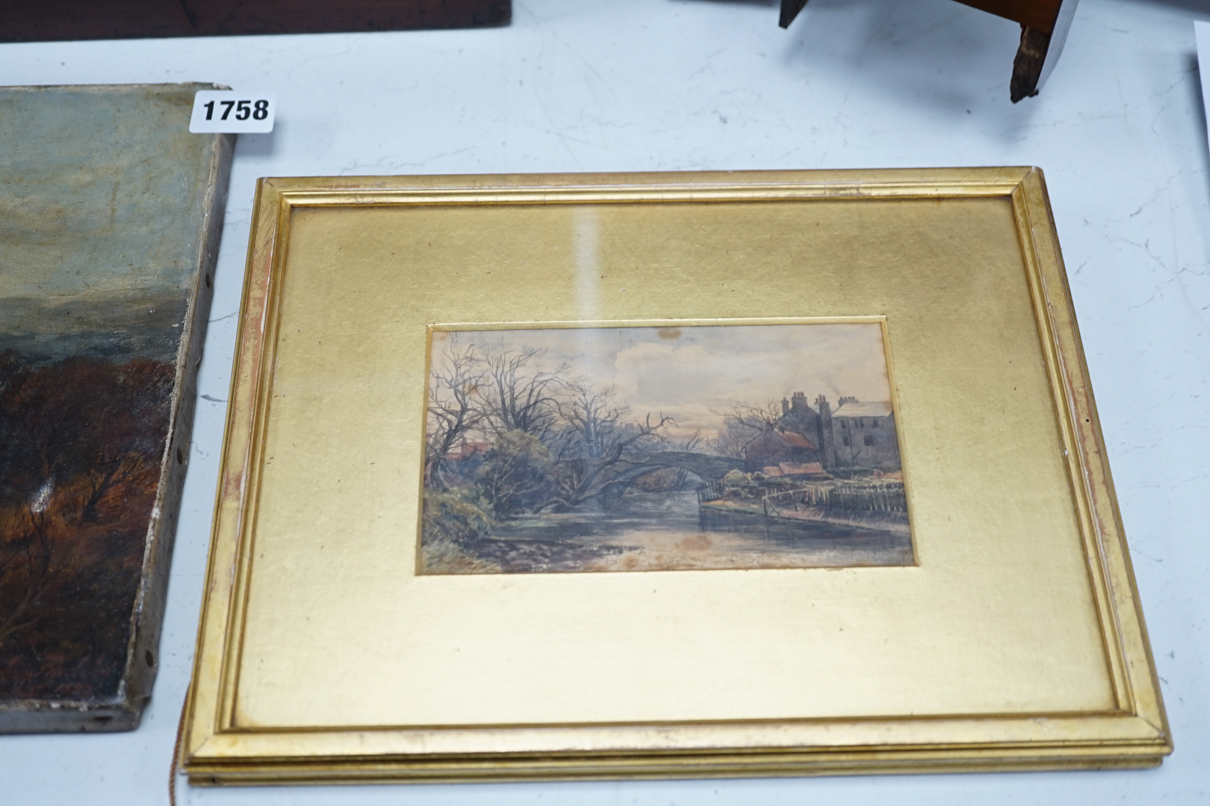 19th century, English school, oil on canvas, View of a town, indistinctly signed and dated 1887, together with a small watercolour, River landscape, indistinctly signed James ...?, largest 25 x 36cm. Condition - poor to